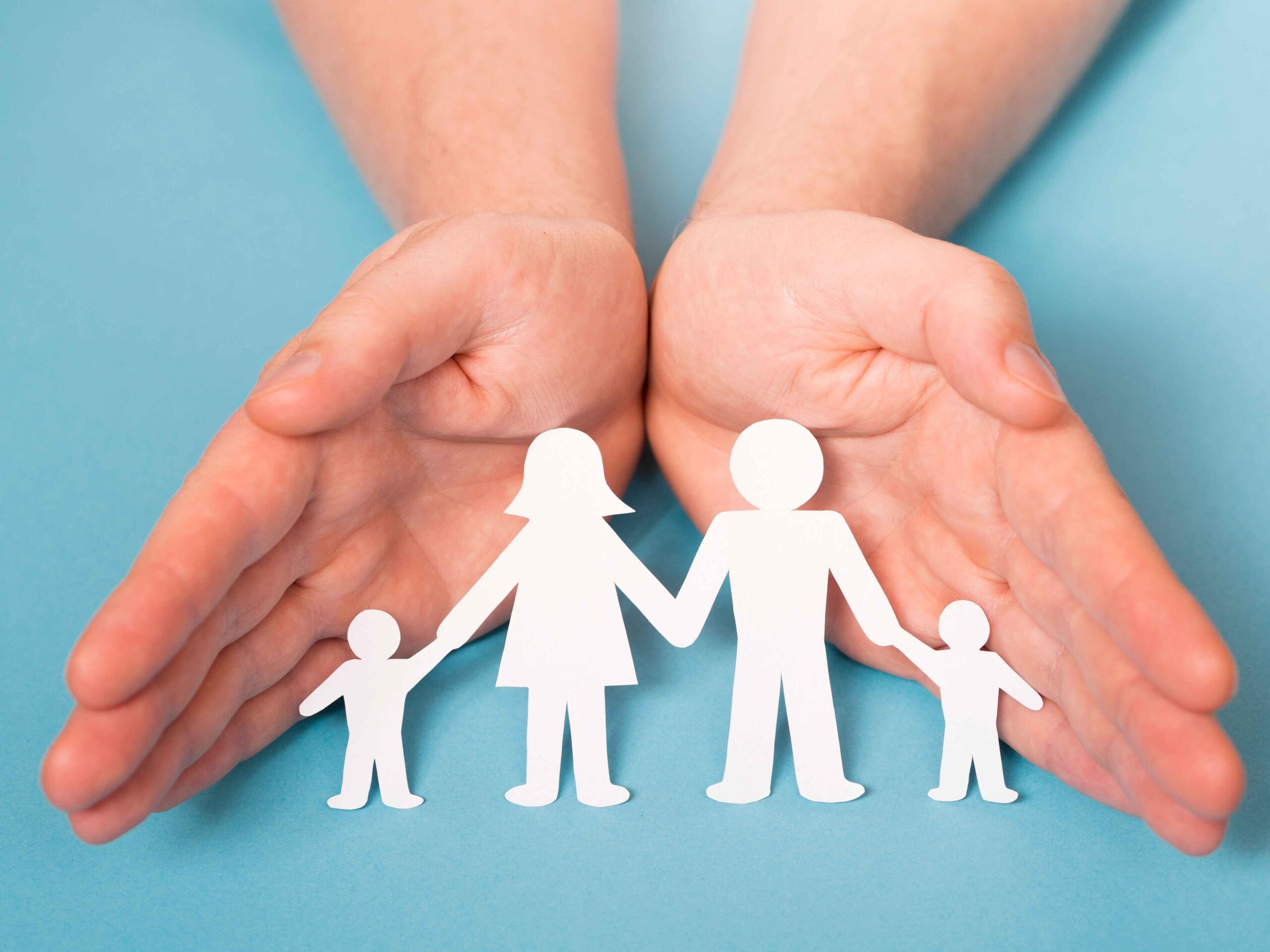 front-view-person-holding-hands-cute-paper-family (1)