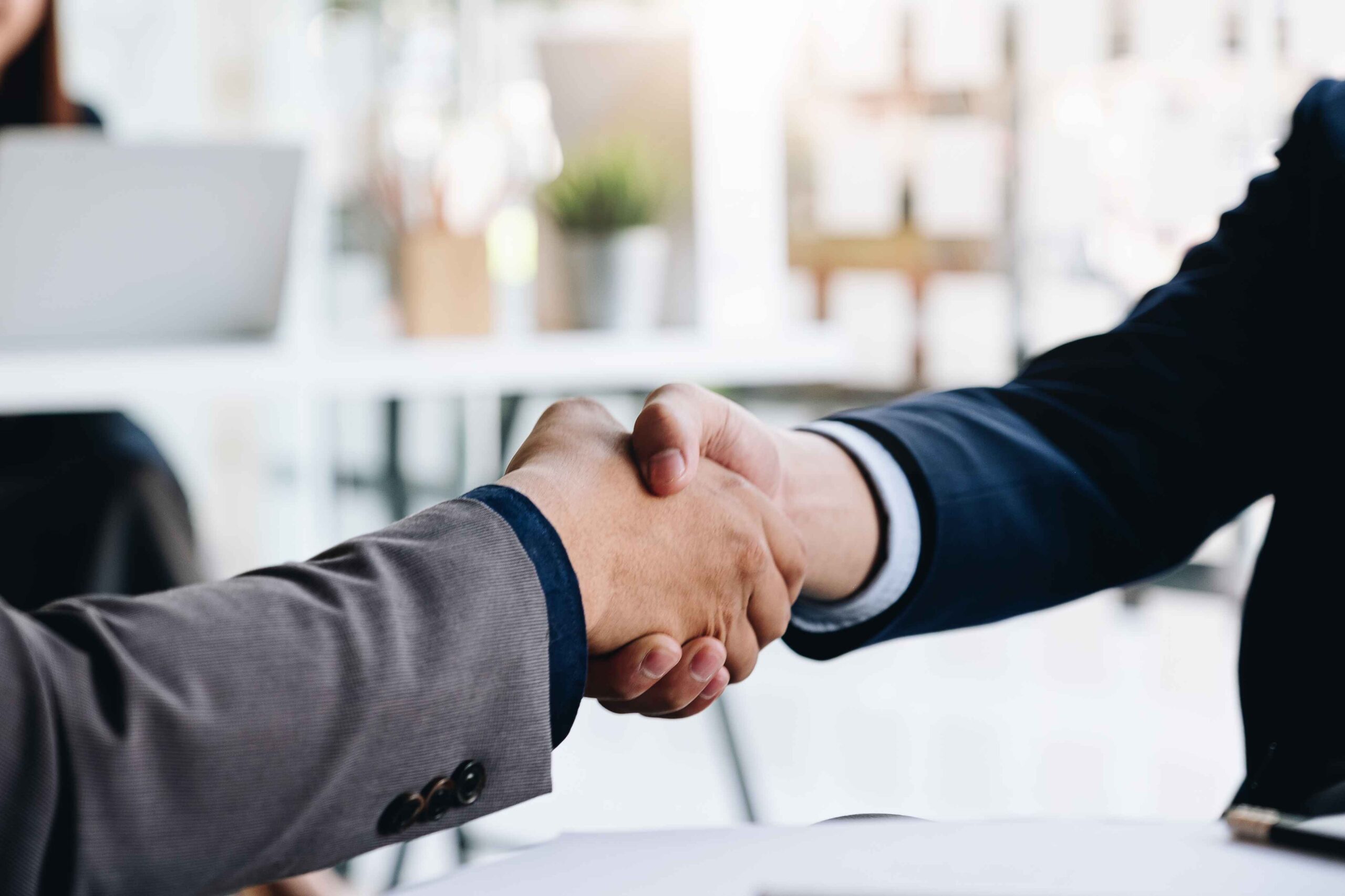 vecteezy_close-up-of-a-handshake-between-two-professionals_1225069 (1)